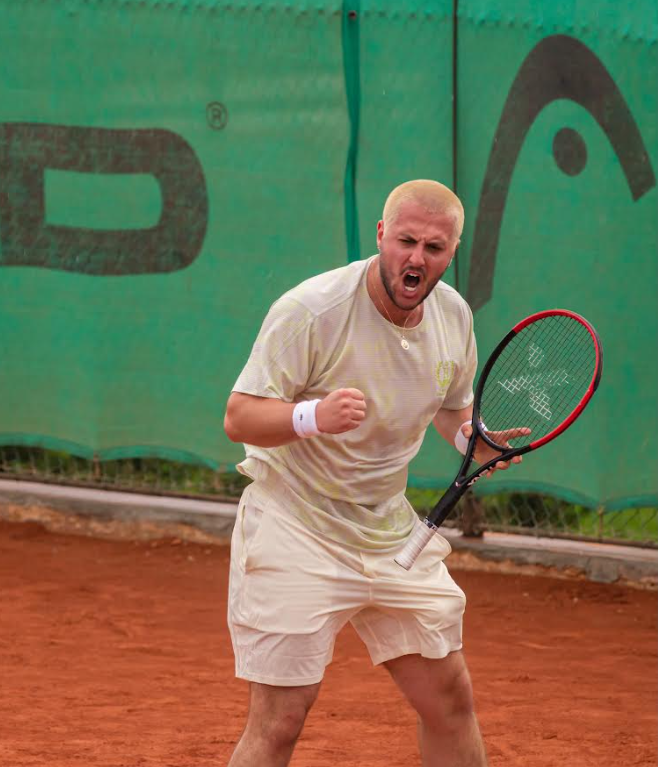 Emir Hamzic celebrating on clay tennis court